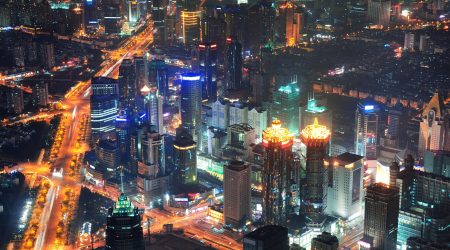 Shanghai city aerial view at night with lights and urban architecture